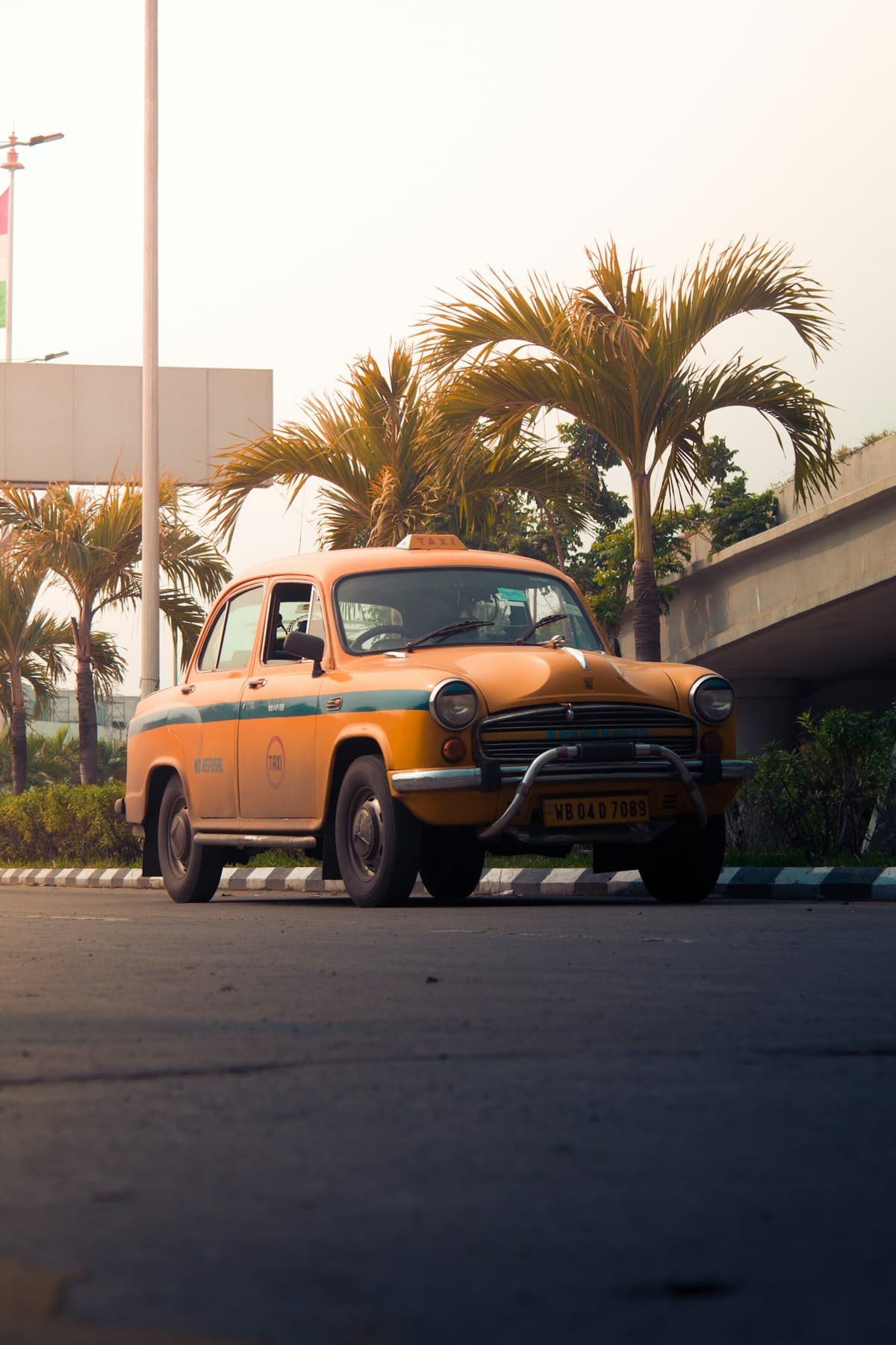Yellow Ambassador local taxi in Chennai — classic Indian city cab service