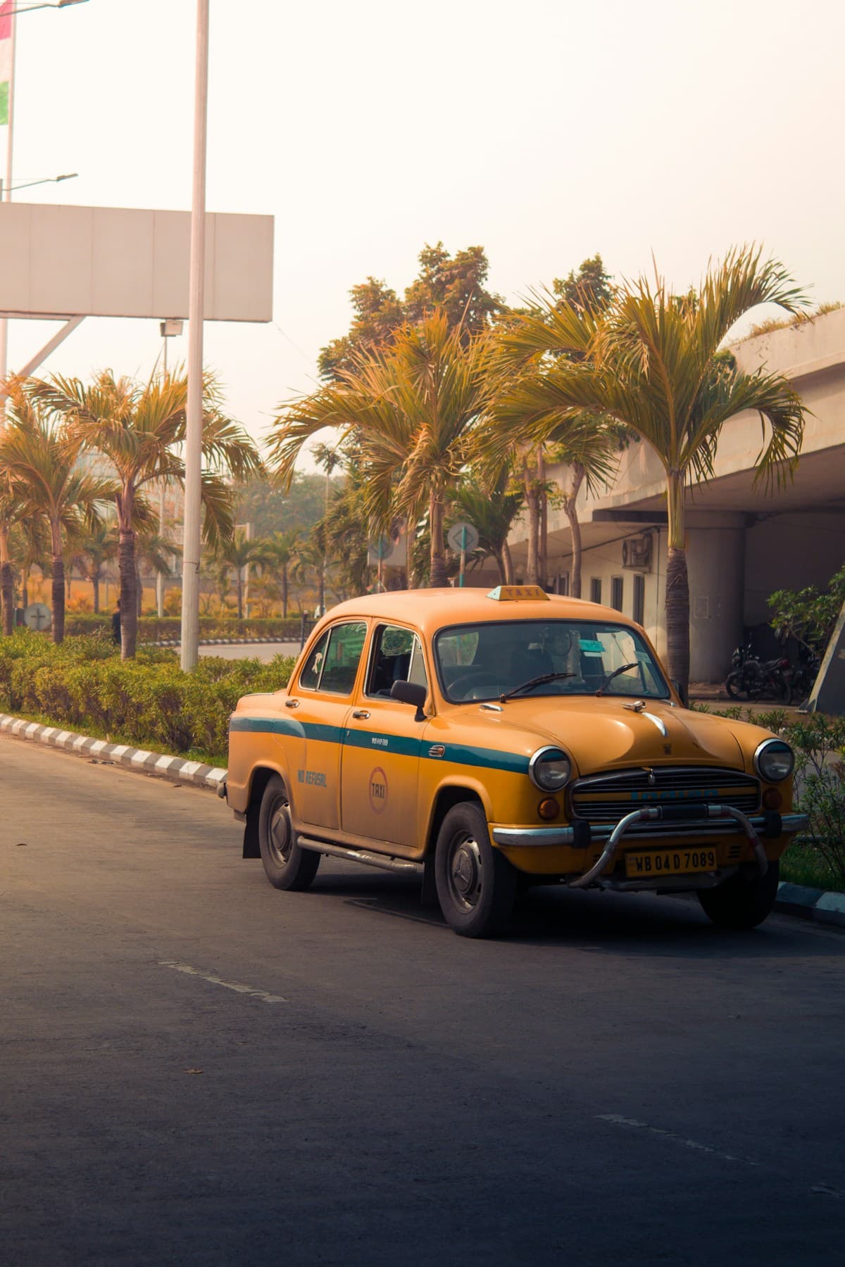 Yellow Kolkata-style local taxi for market trips in Chennai